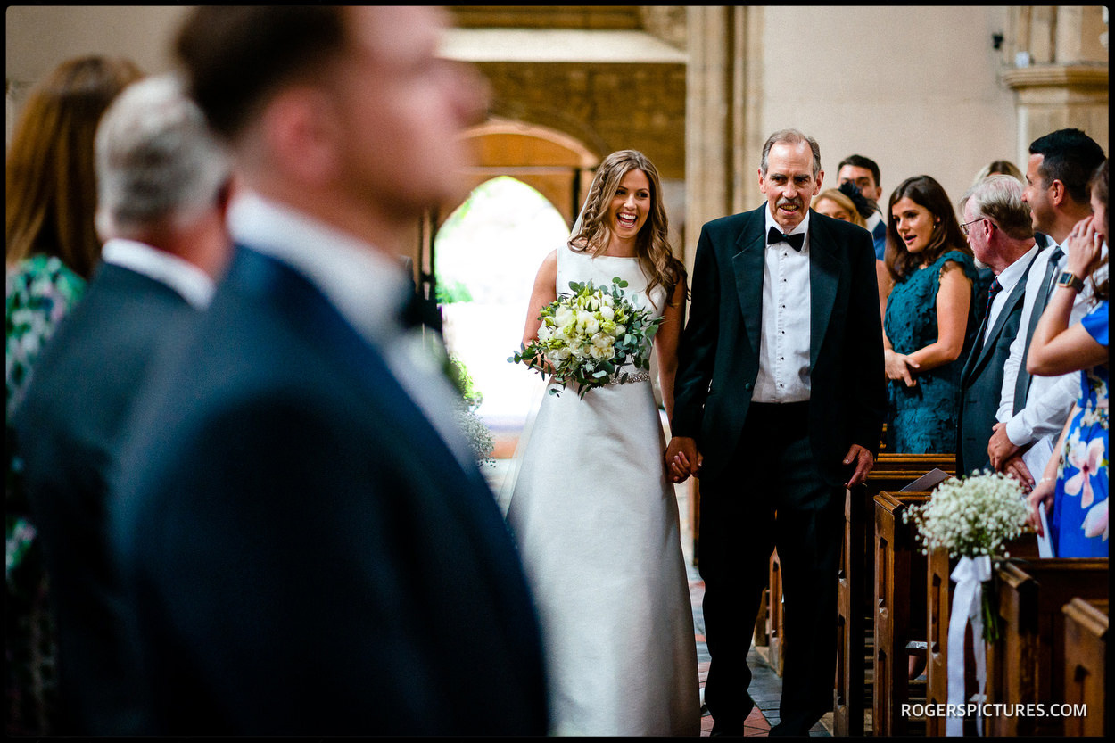 Bride and father walk down the aisle in Buckinghamshire church wedding