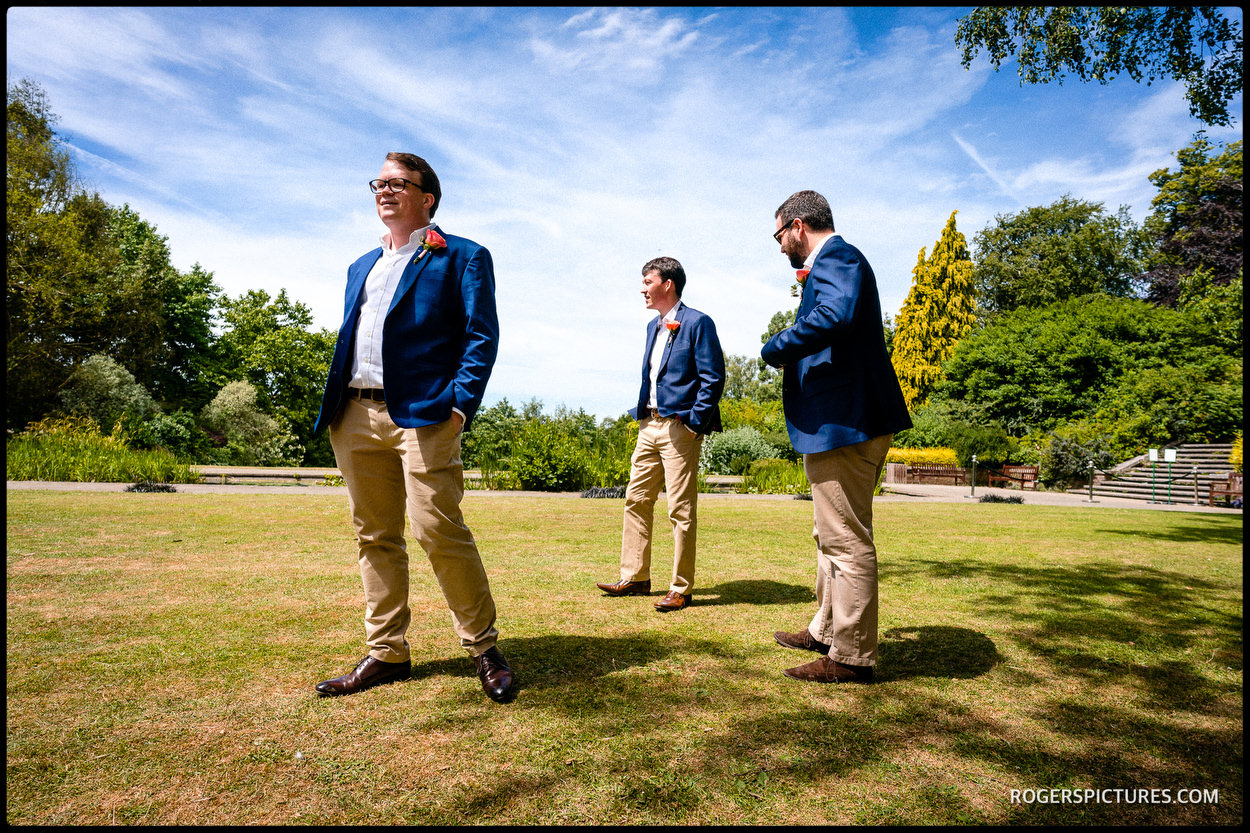 Groomsmen wait at The Hill Garden in Hampstead