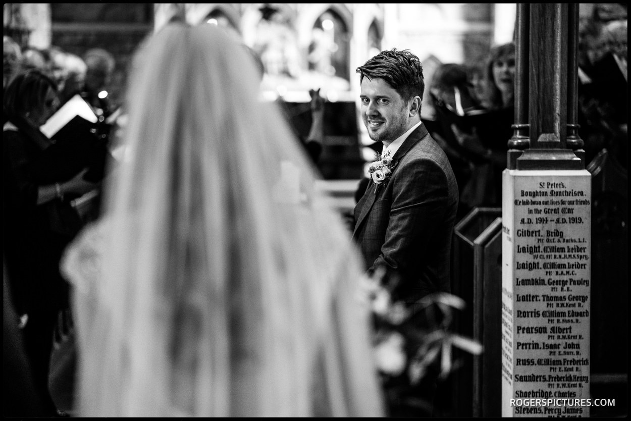 Grooms first look at bride in church