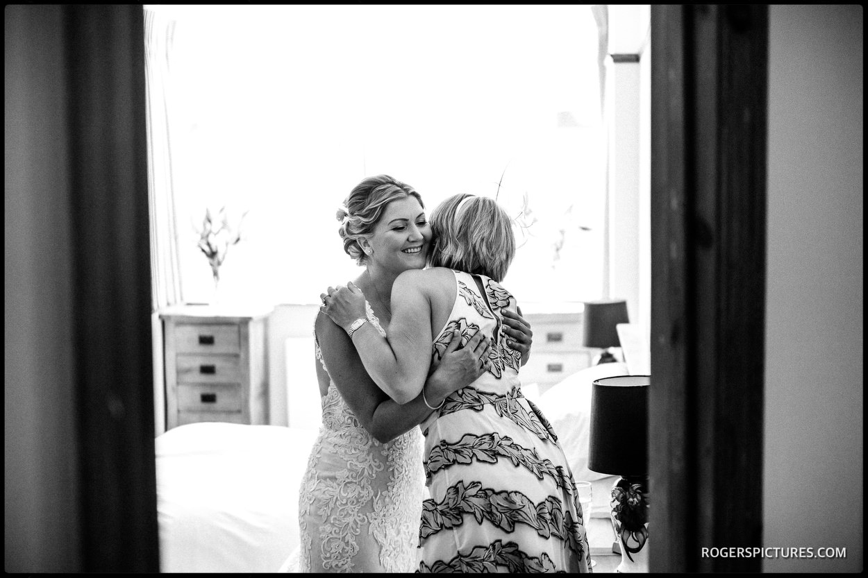 Bride and sister hug