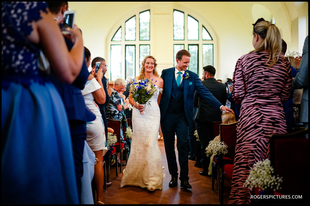 Newly married couple at Dulwich college wedding in the Old Library