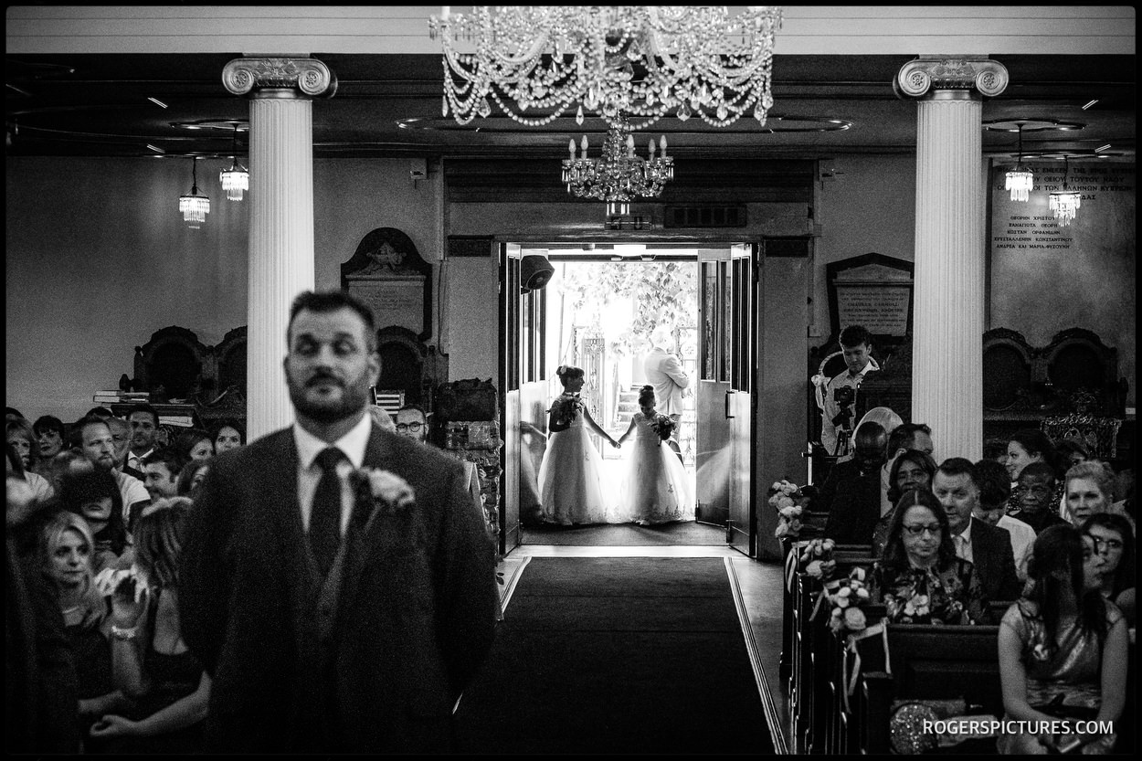 Bridesmaids arrive at the Greek Cathedral in London