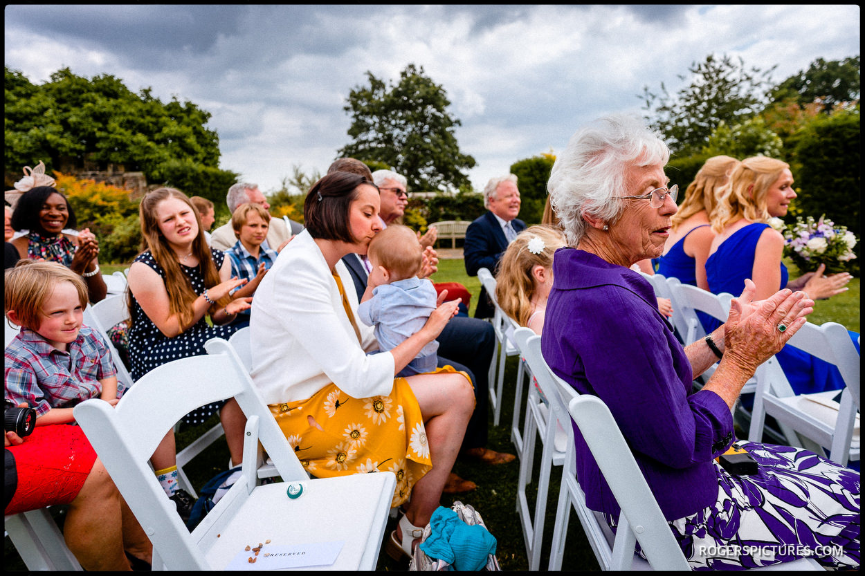 Guests at an outdoor ceremony at Wadhurst Castle in Sussex