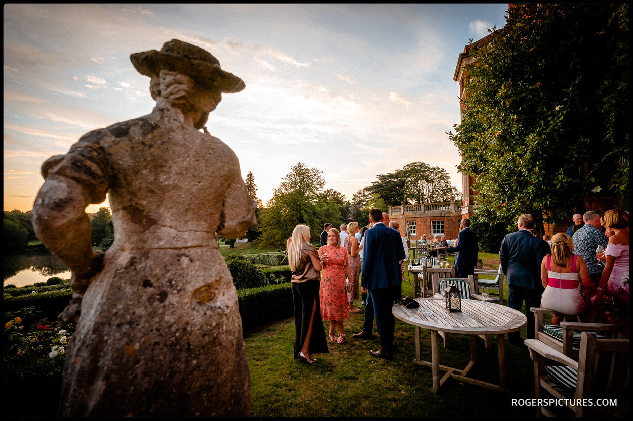 Guests in the garden during a summer wedding