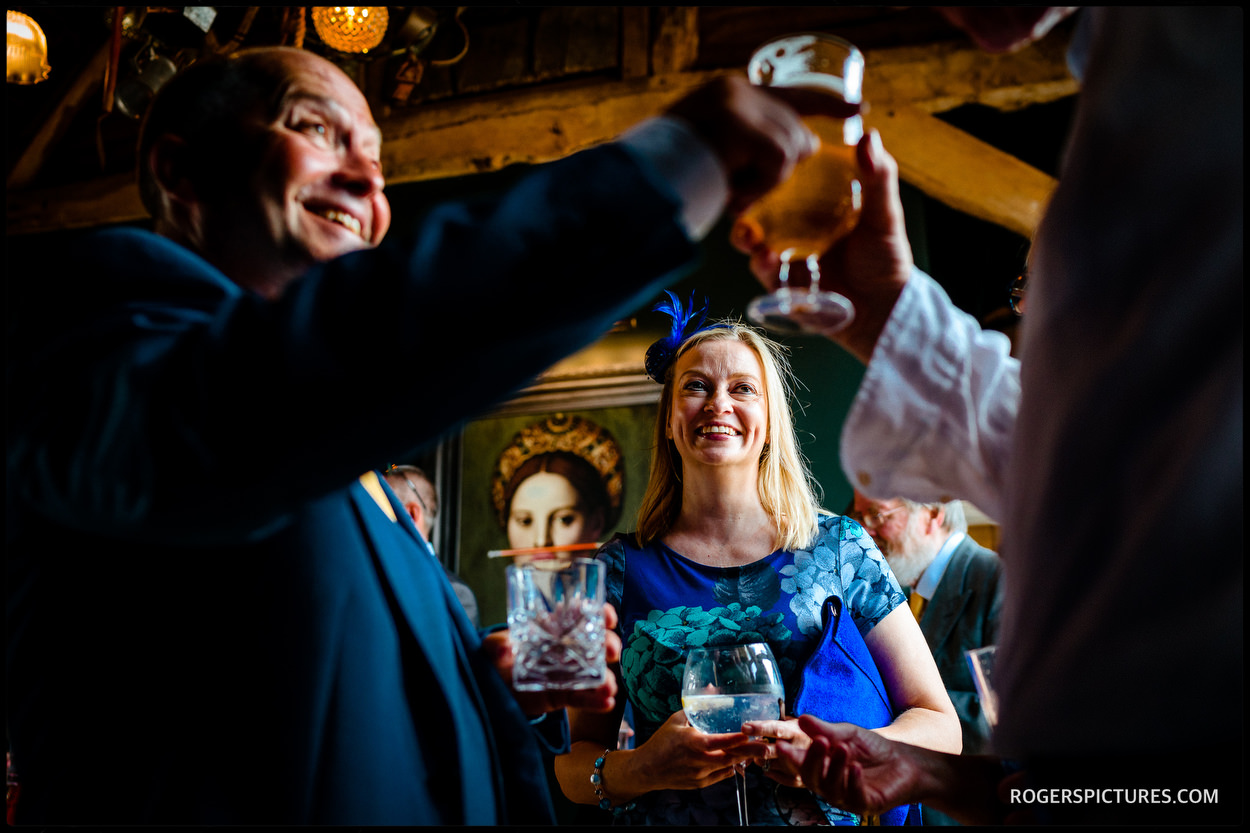 Wedding guests at Redcoats Barns near Hitchin in Hertfordshire