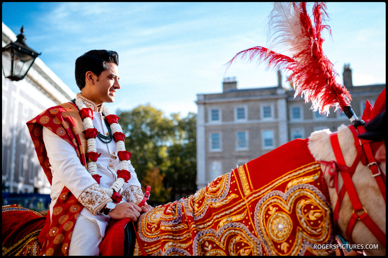 Indian groom arrives on horseback