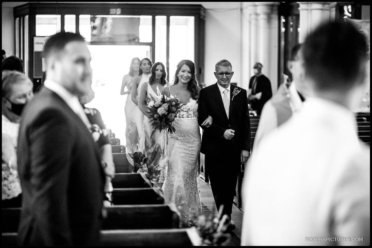 Bride and Dad walk down the aisle in Hertfordshire
