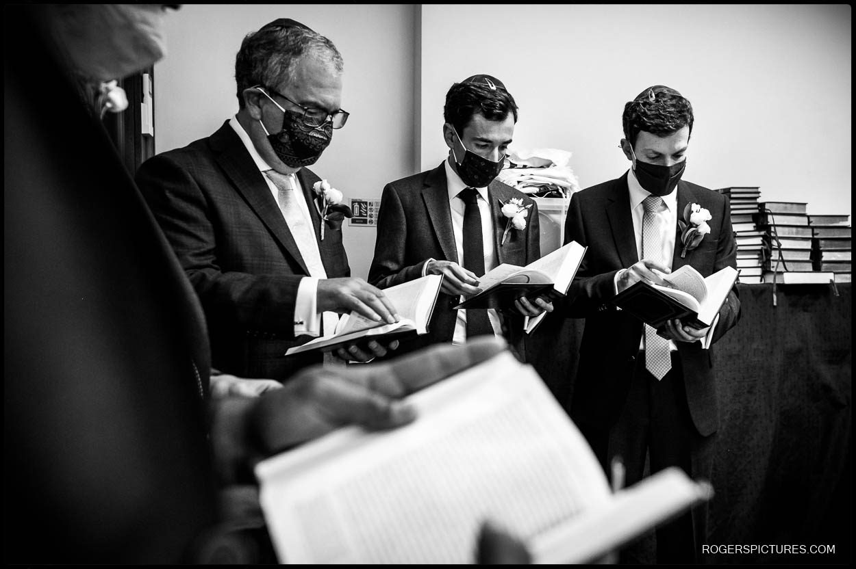 Groomsmen during the Tish at Hampstead Garden Suburb Synagogue