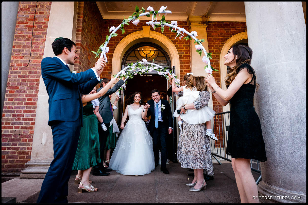 Bride and groom leave Hampstead Garden Suburb Synagogue