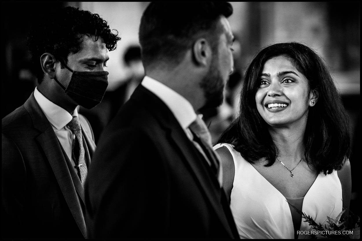 Bride sees groom at altar at church wedding in London