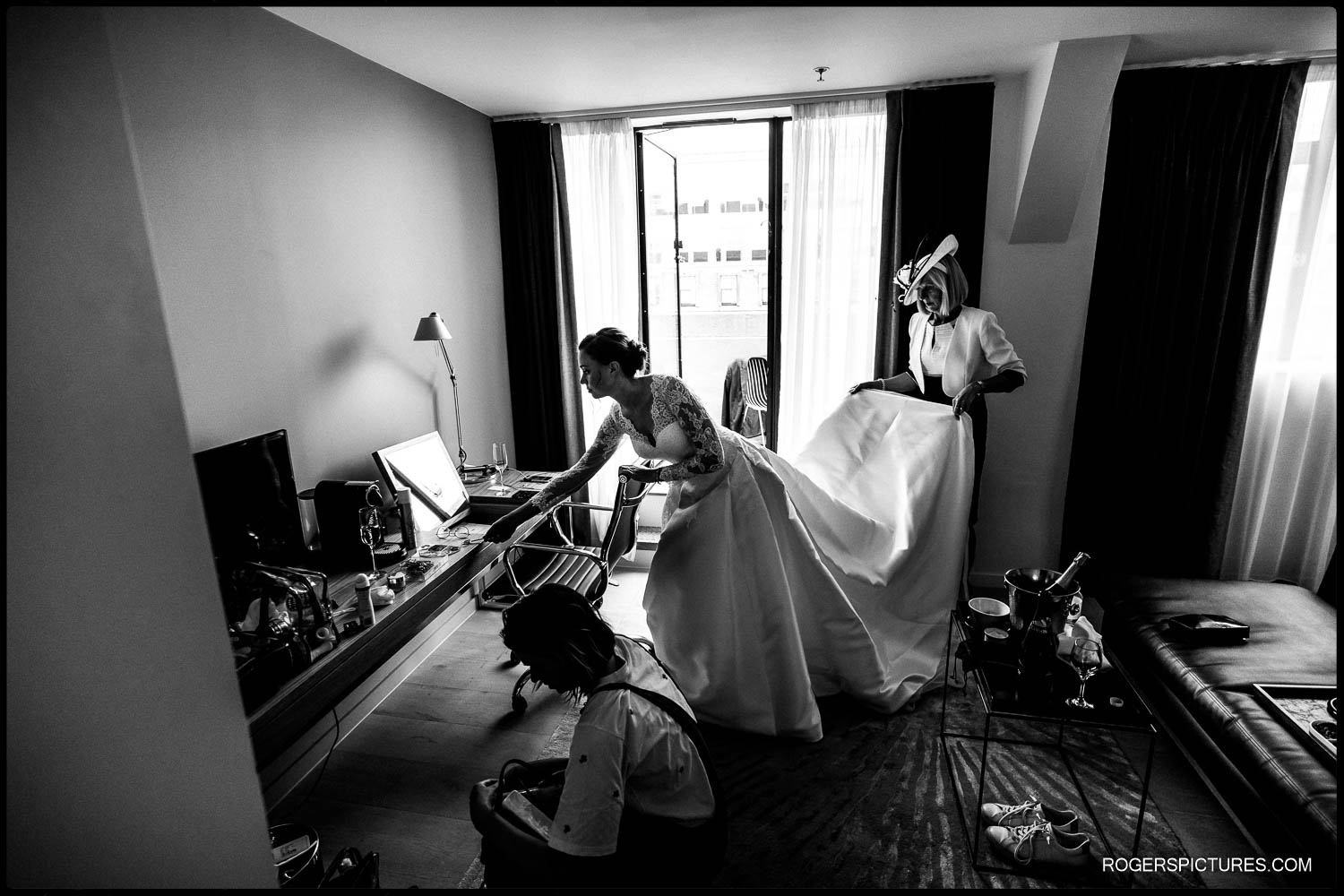 Monotone photograph of a bride in wedding dress with Mother before a London wedding ceremony