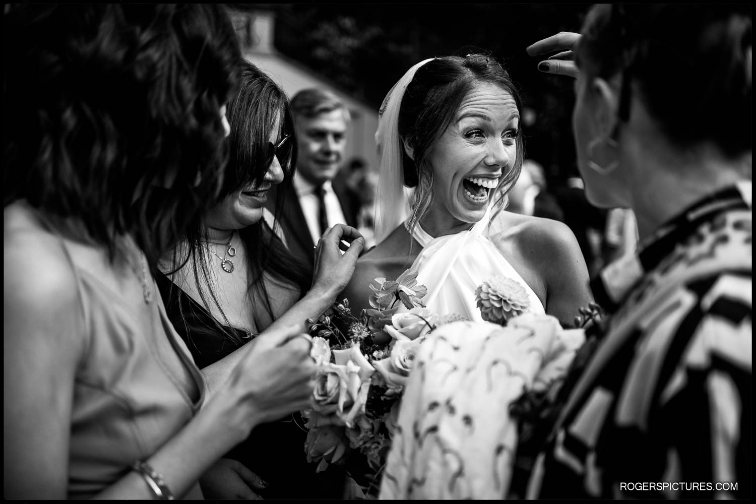 Laughing bride in wedding dress on her wedding day