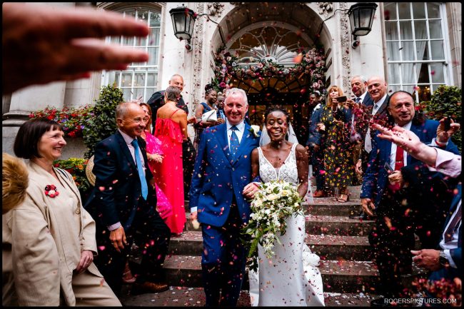 Chelsea Old Town Hall and Little Italy Wedding 043 Wedding couple and confetti on the steps at Chelsea Old Town Hall