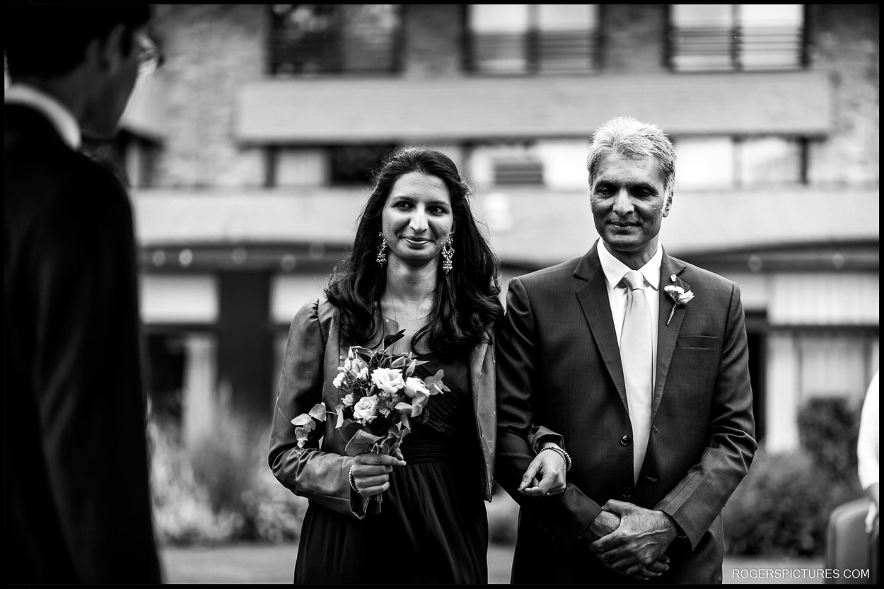 Bride and Father walk down the aisle in Cambridge