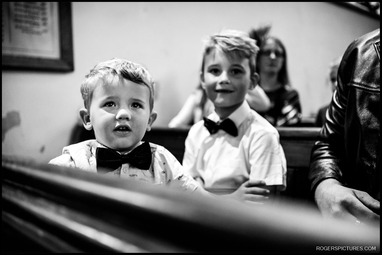 Black and white wedding photo of children in bow-ties