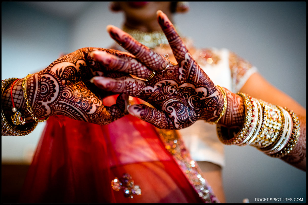 Bride's hands with henna getting ready