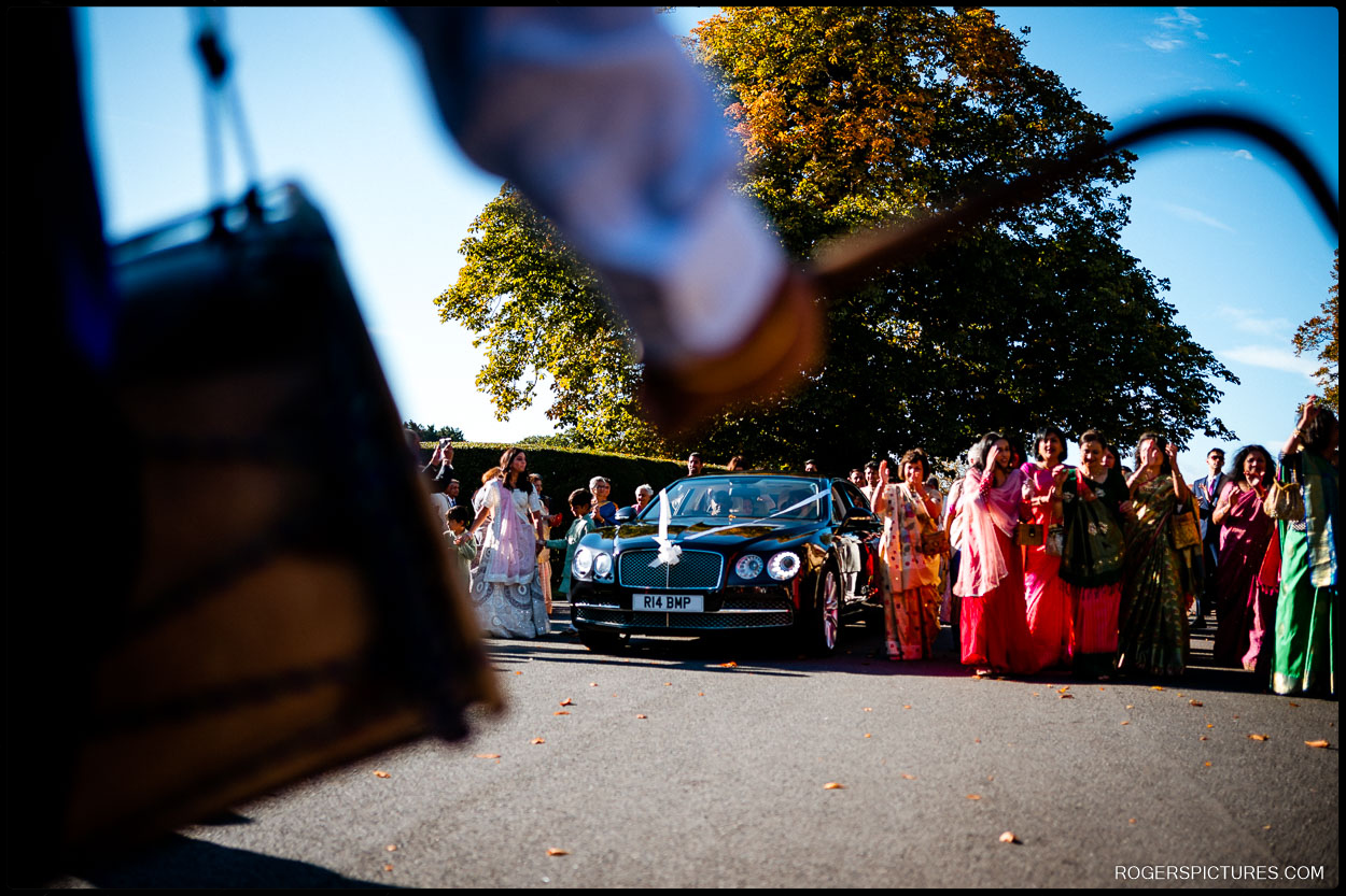 Groom arrives at Parklands Quendon Hall for the Baraat in a Hindu wedding ceremony