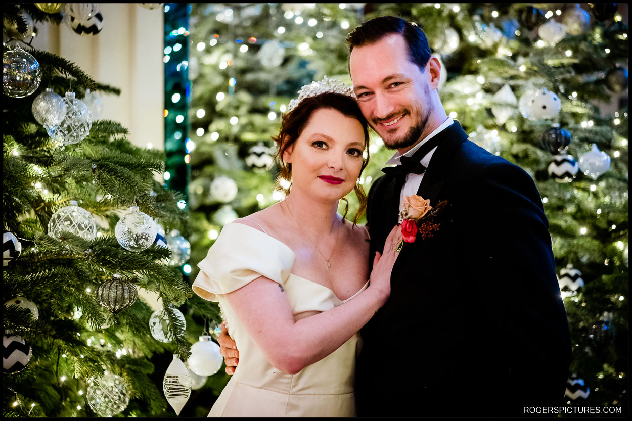 Christmas portrait of bride and groom after getting married at Claridges