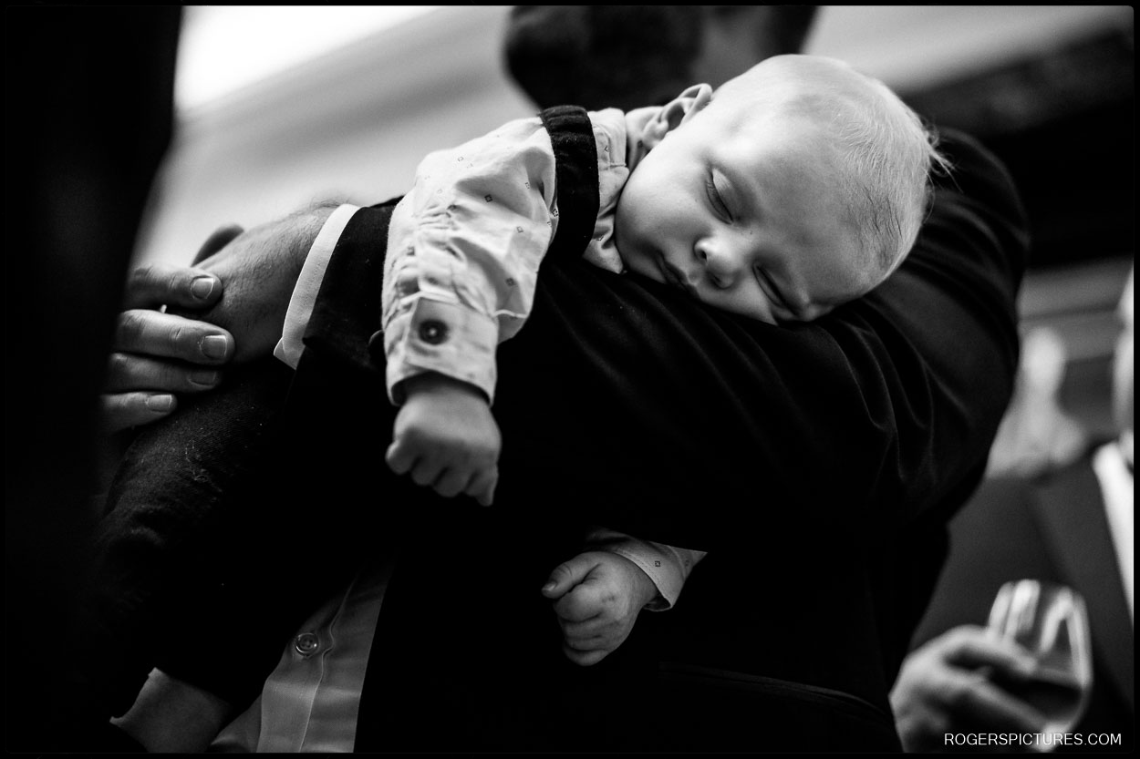 Sleeping baby at a Winter wedding in London