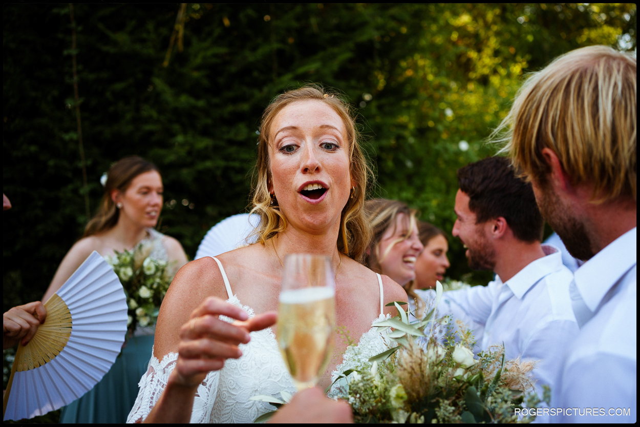 Bride  and glass of champagne after wedding ceremony