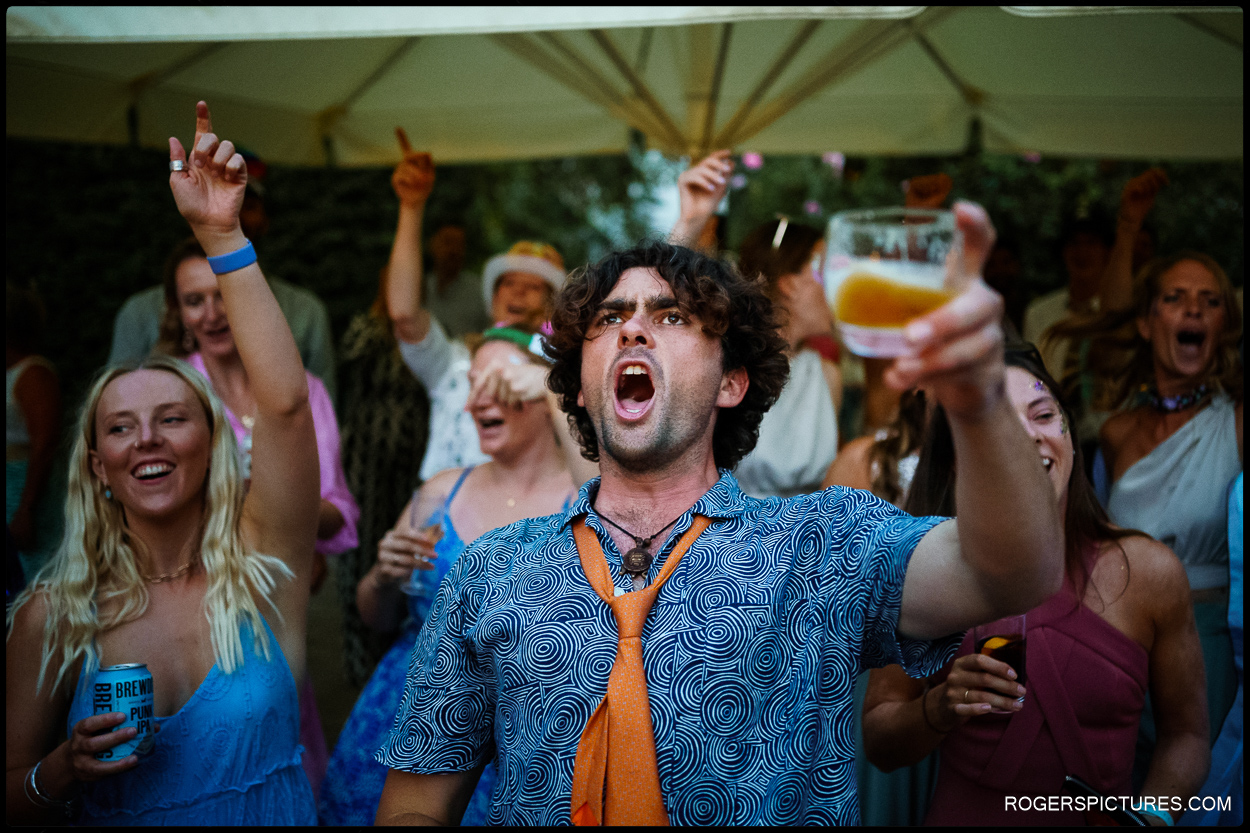 Guests partying at a festival wedding