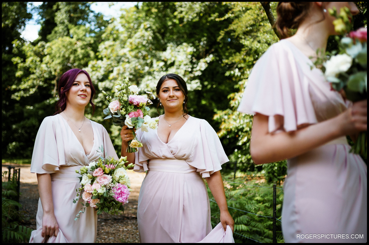 Bridesmaids wait for the bright arrive at a church wedding