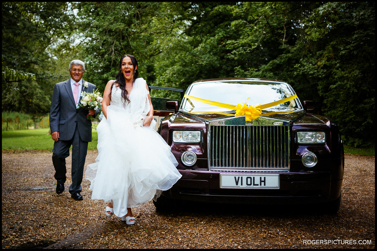 Bride and Rolls Royce wedding car at church wedding in Somerset
