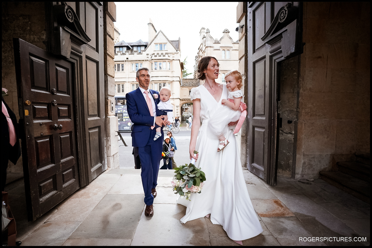 Bride and groom arrive at Queens college Oxford for reception