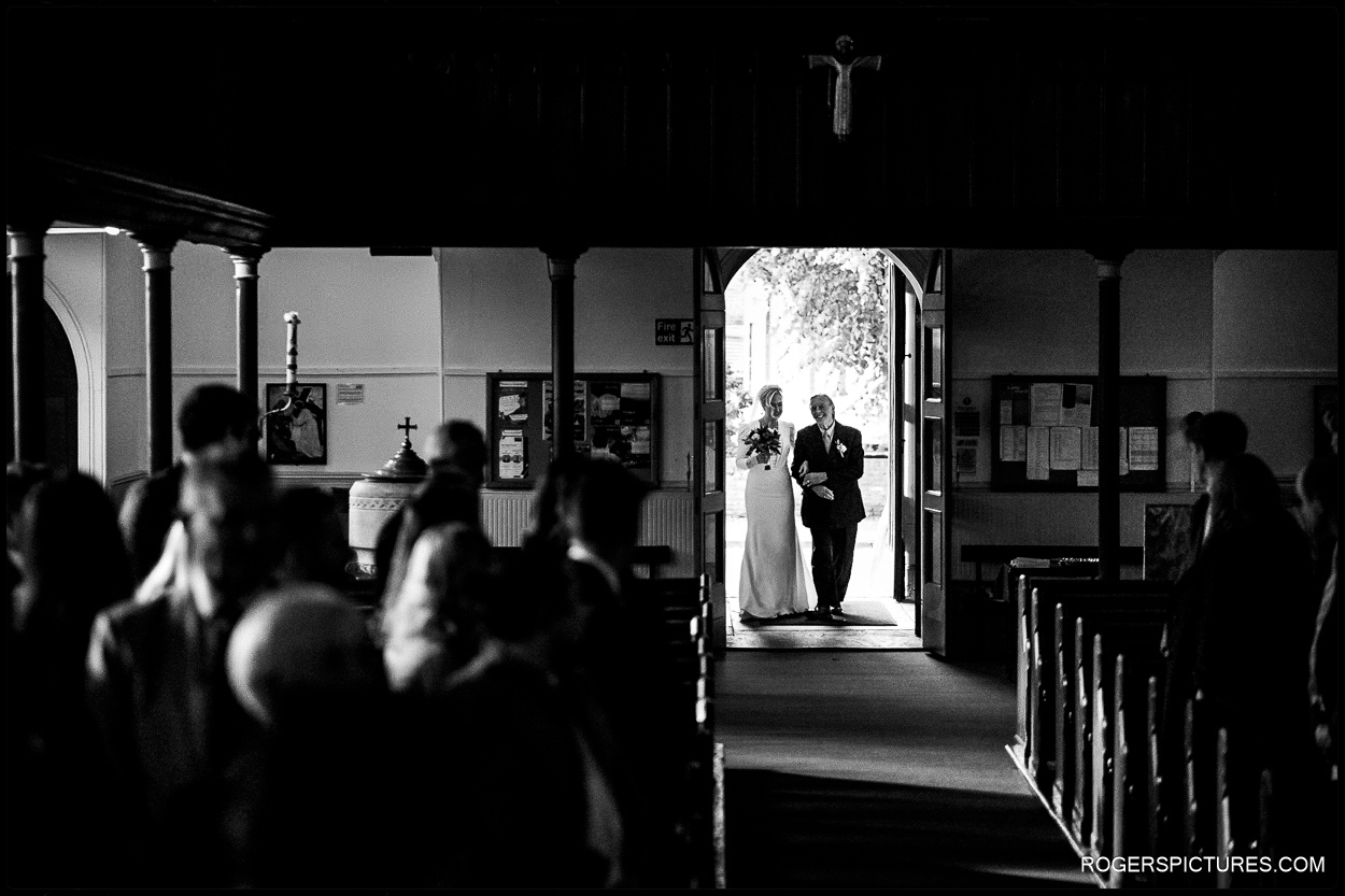 Bride and Father arrive for church wedding in East London