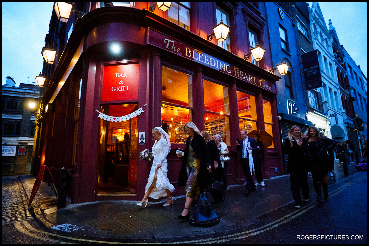 Wedding party arrives at the Bleeding Heart in London