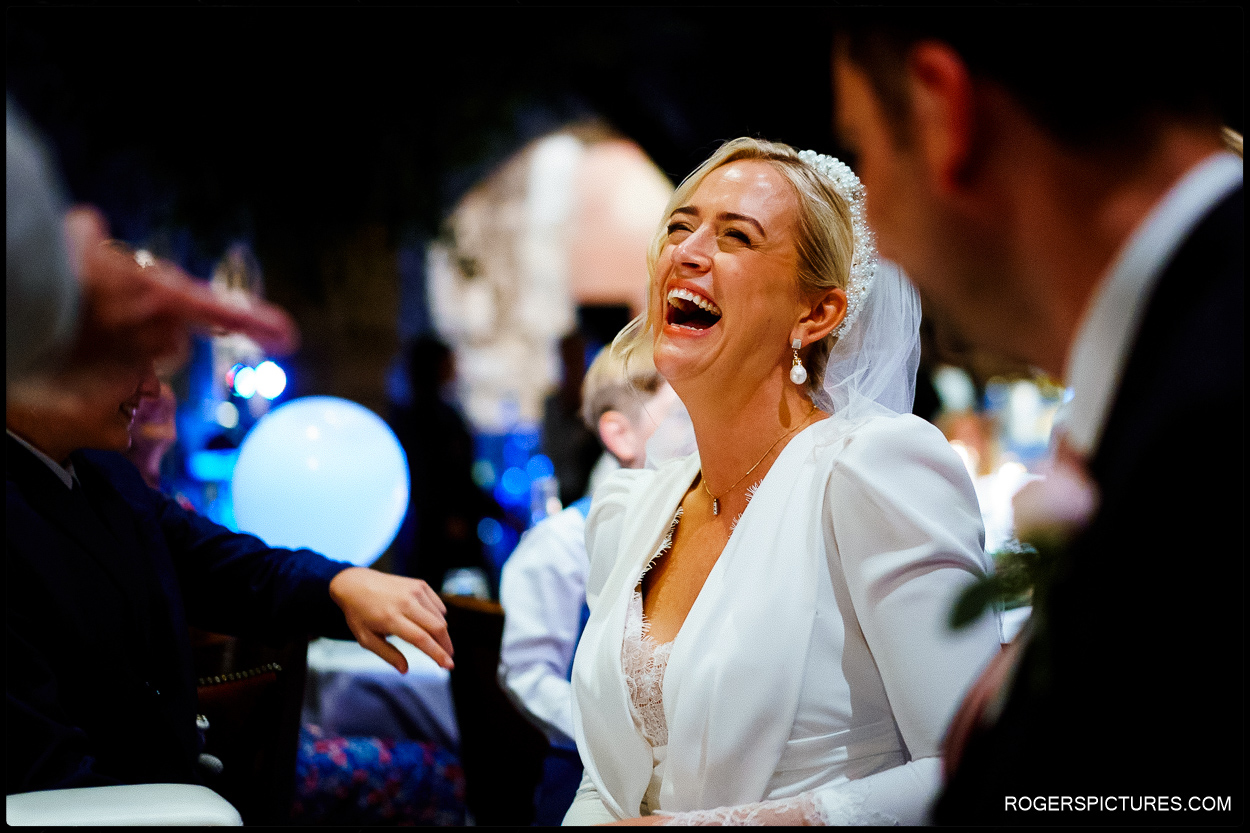 Bride reacts during speeches at the Crypt on Ely Place