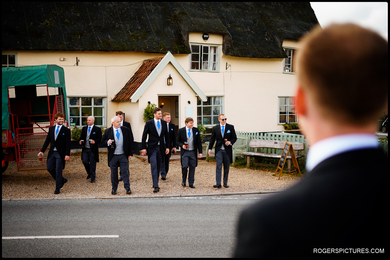 Groom and groomsmen at a pub before wedding ceremony