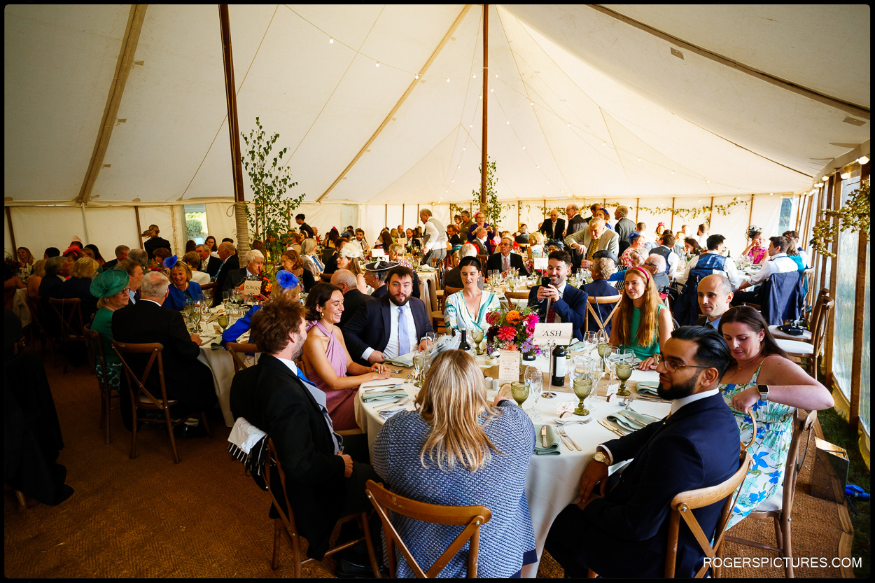 Guest seated in the marquee at a Norfolk wedding