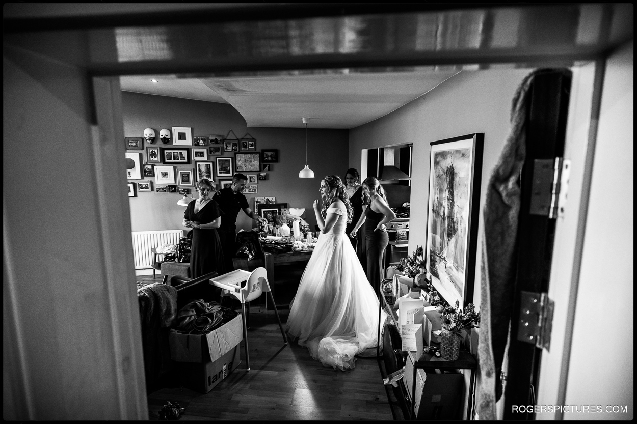 Black and white photograph of bride getting ready