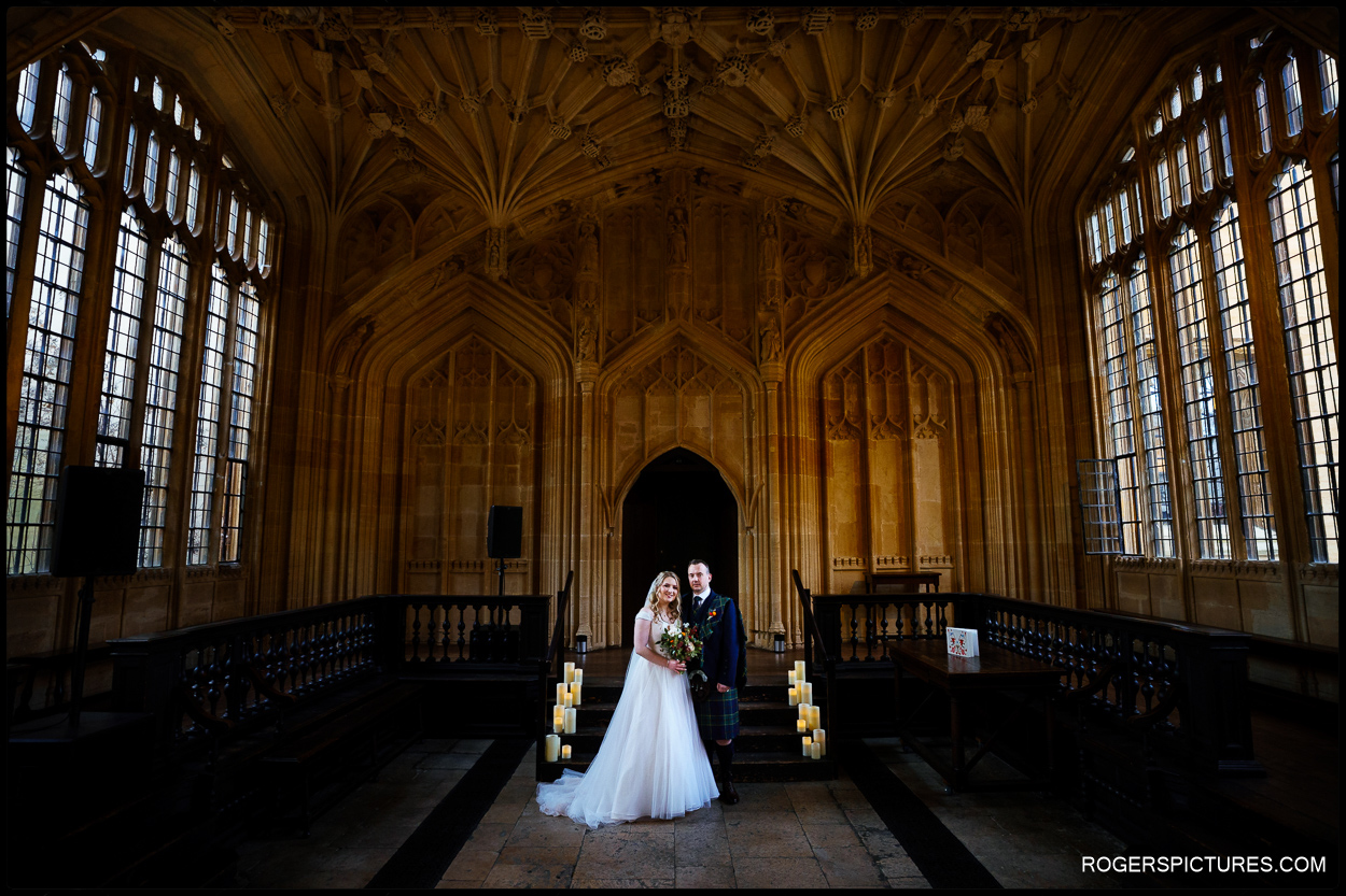 Bride and groom portrait in the Divinity School at the Bodleian libraries in Oxford