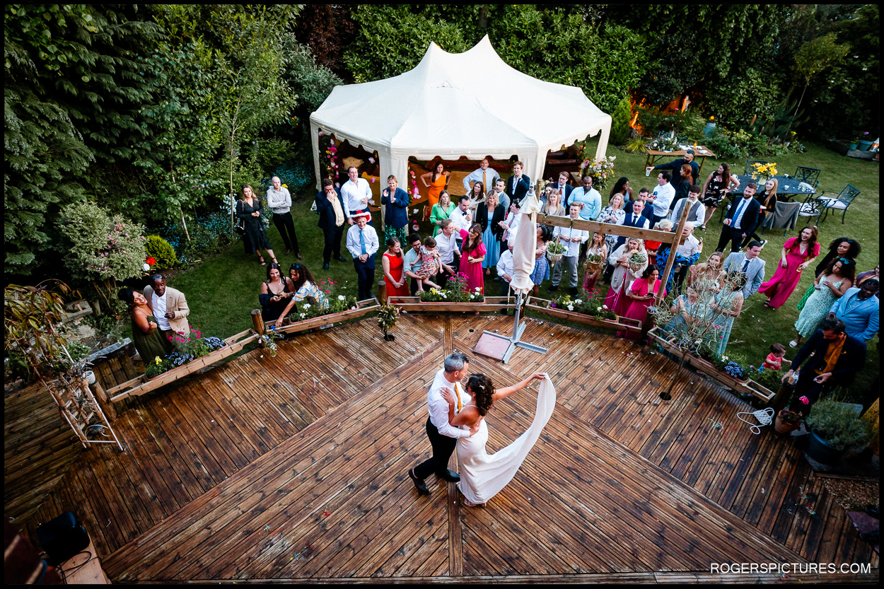 Bride and groom first dance at an outdoor garden wedding