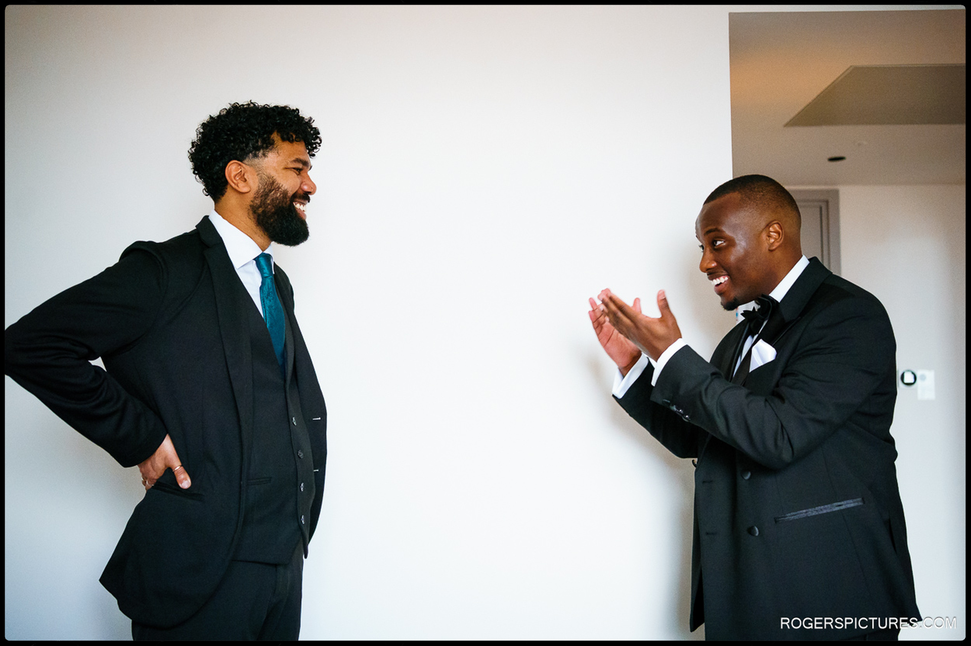 Groom and best man sharing a laugh while getting ready at Southgate Hotel