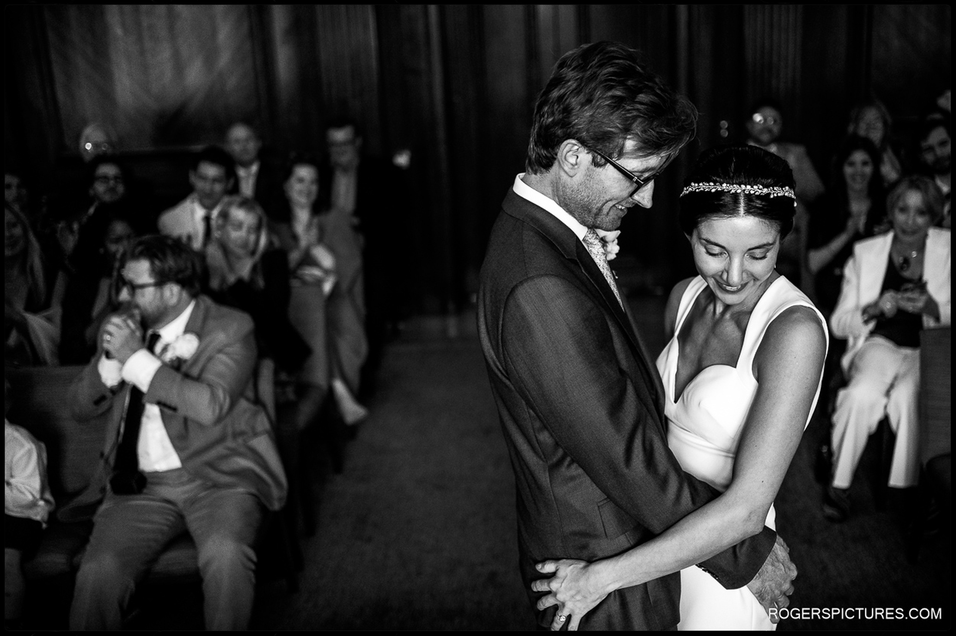 A quiet moment captured between the bride and groom during the wedding ceremony at Marylebone Town Hall.