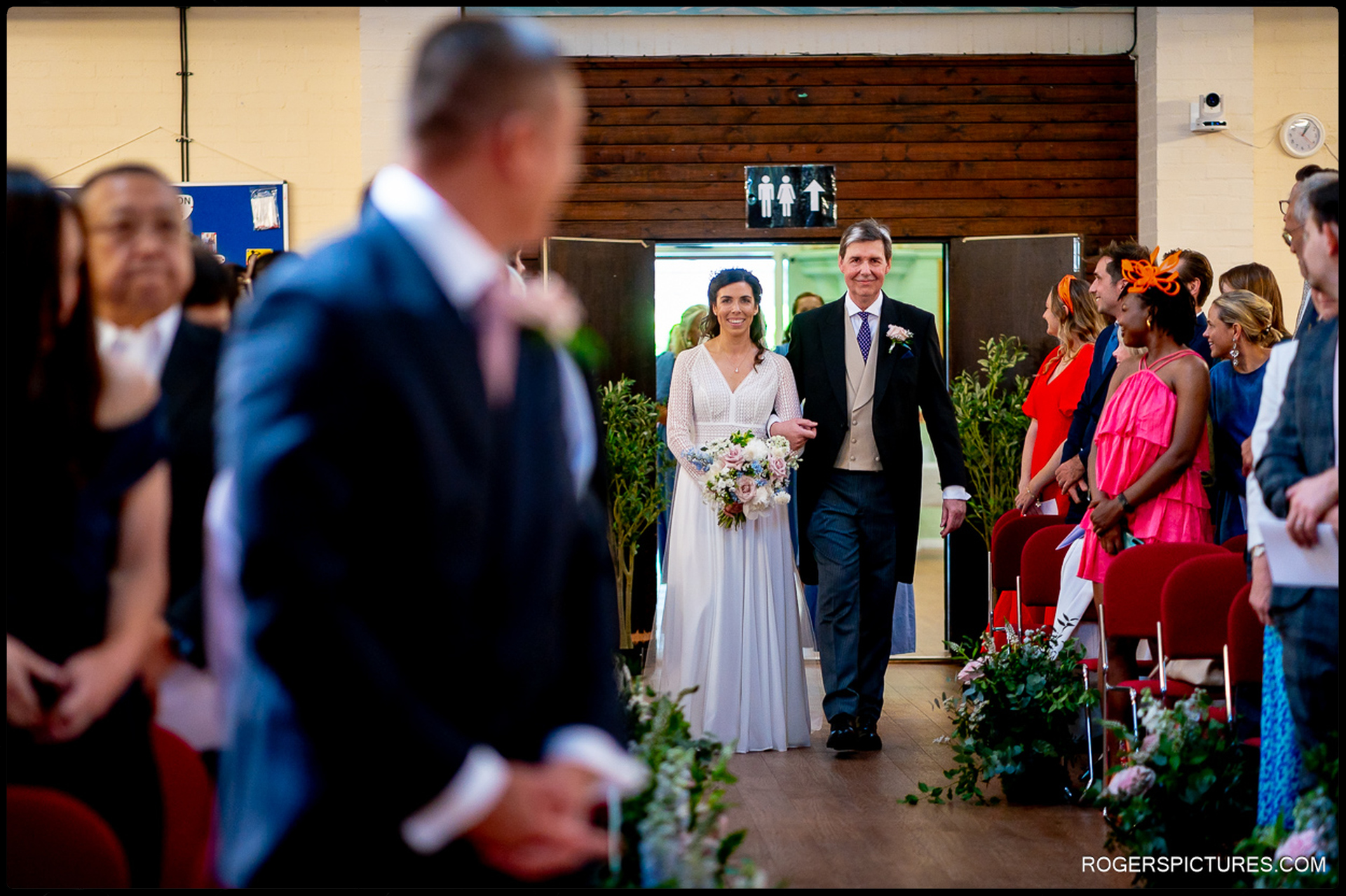 Bride walking down the aisle with her father at St Peter’s Church in Fulham.