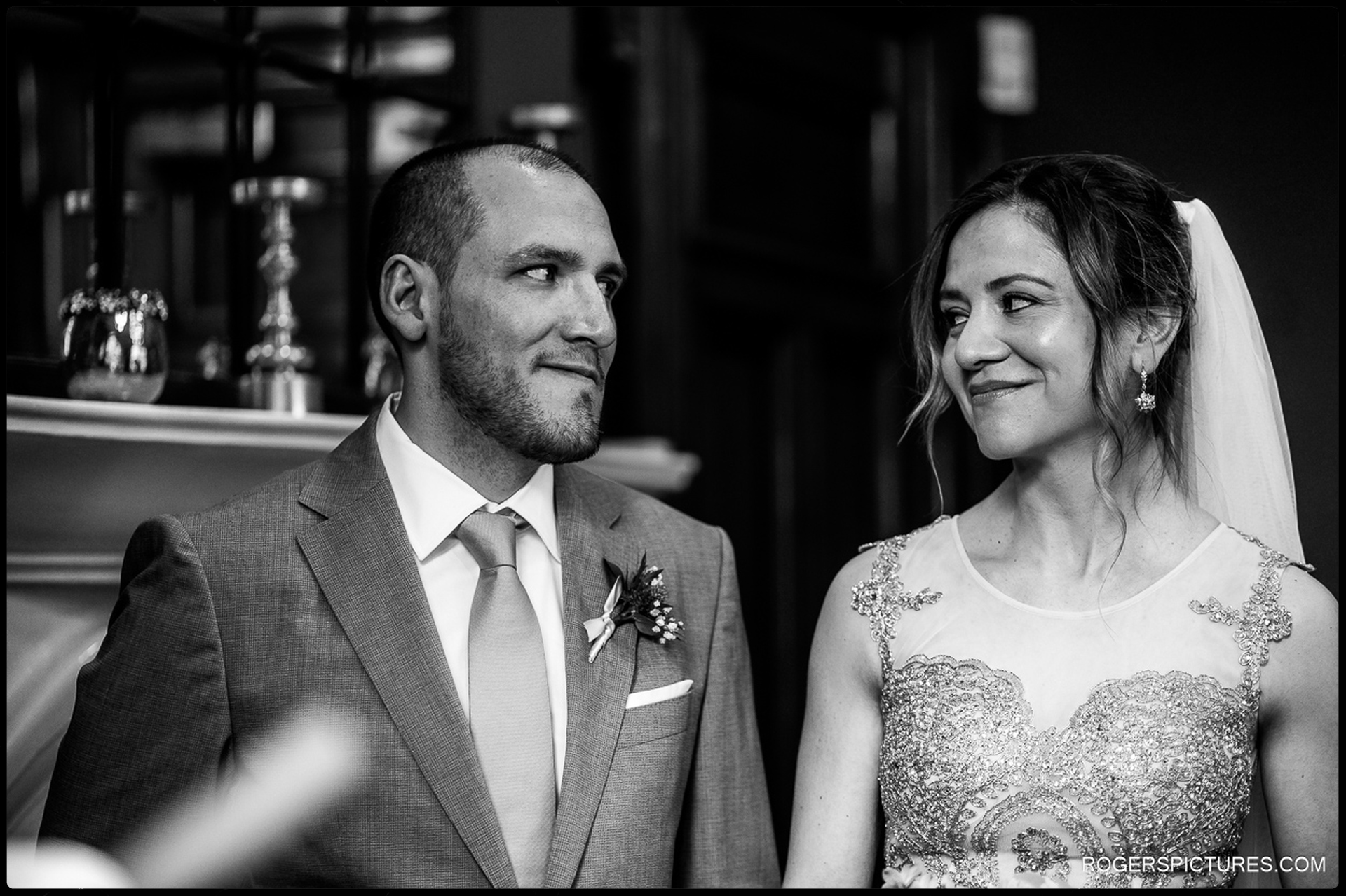 Bride and groom share a glance at City Chambers wedding