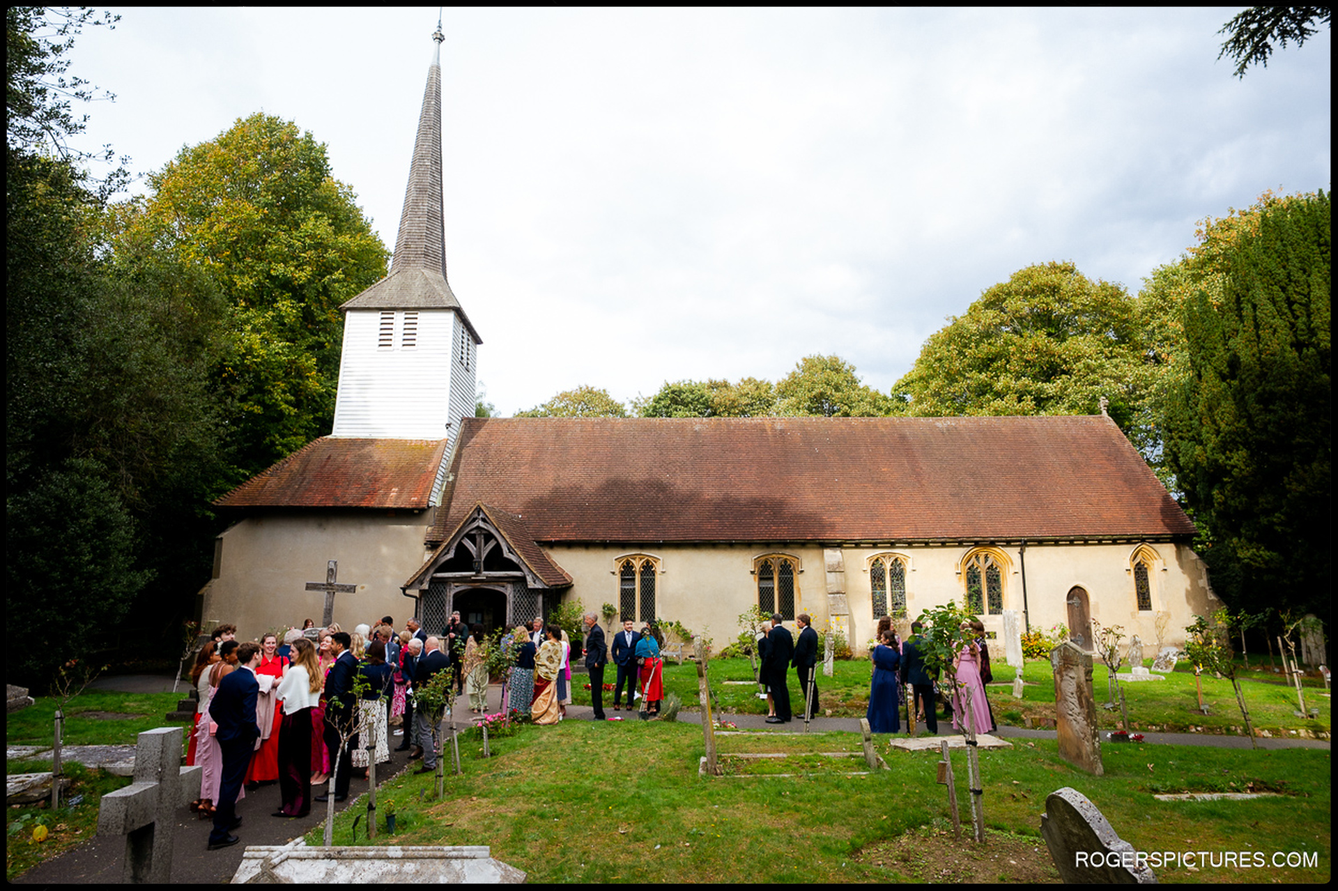 Guests gather in the churchyard, chatting and congratulating the couple outside St Mary’s.