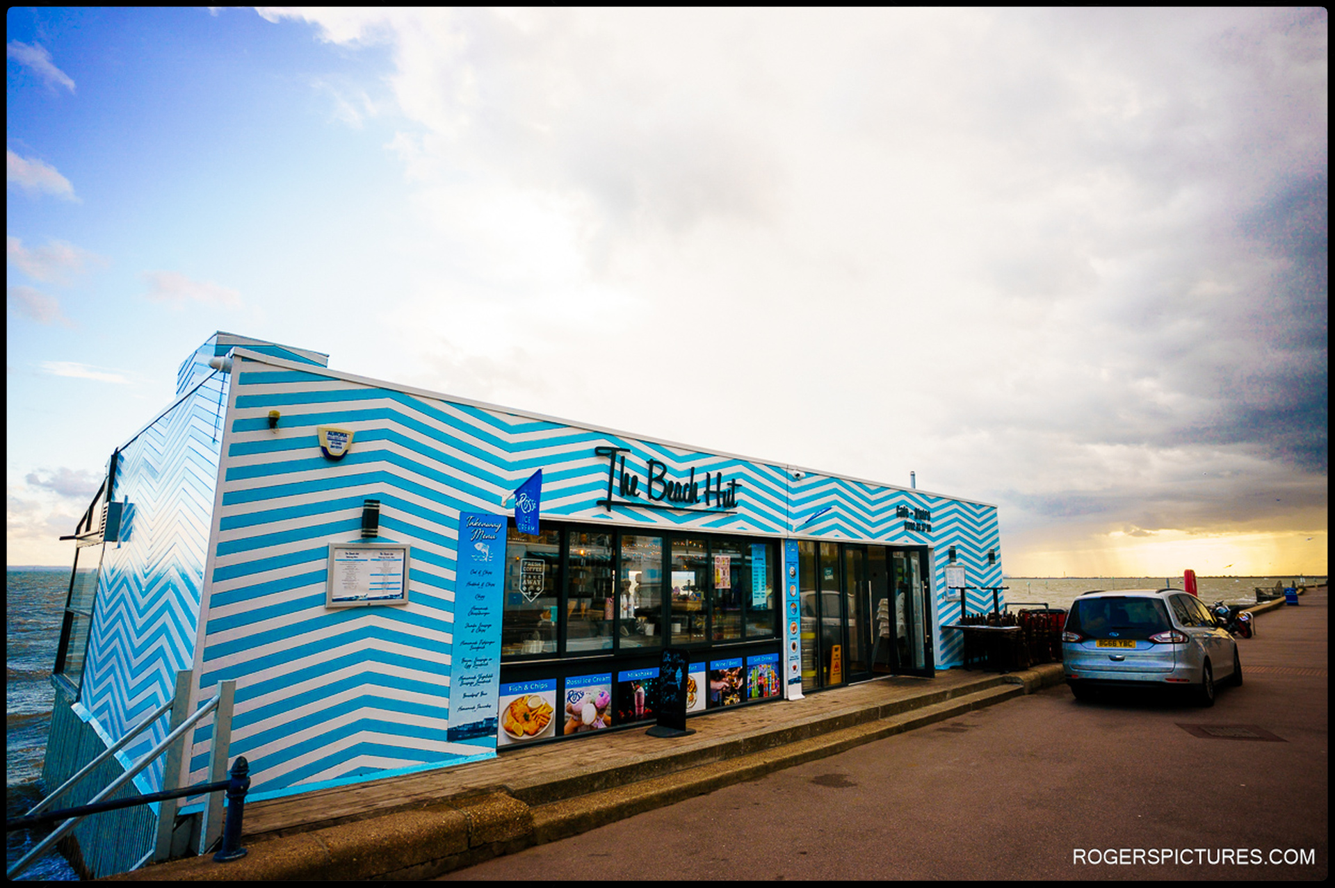 Exterior of The Beach Hut in Southend-on-Sea, striped blue café by the seaside