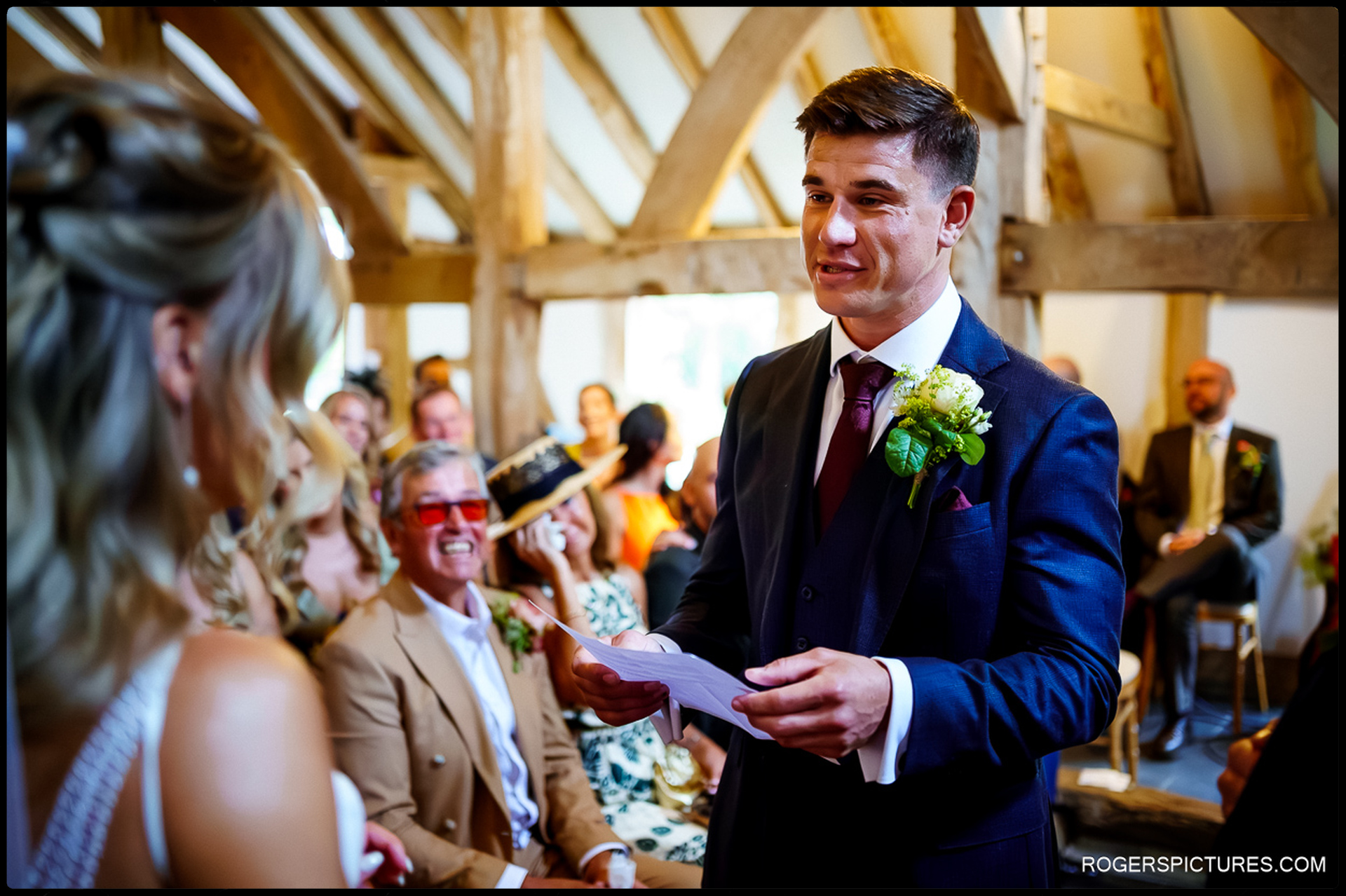 Groom reading his vows to the bride during their ceremony at Rumbolds Farm.